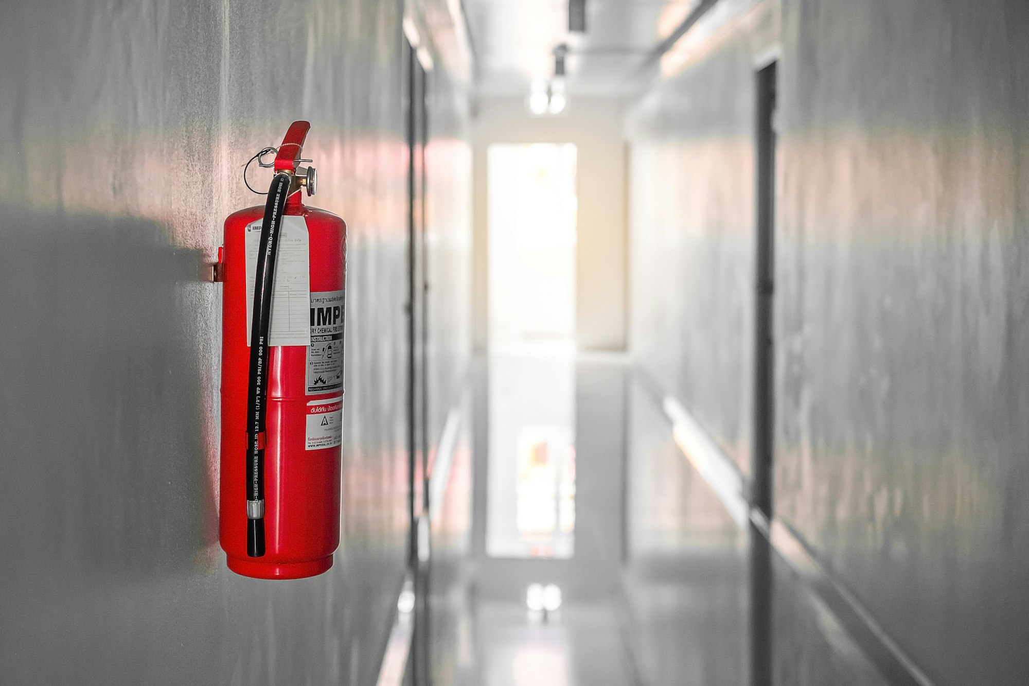 Fire extinguisher system on the wall background,