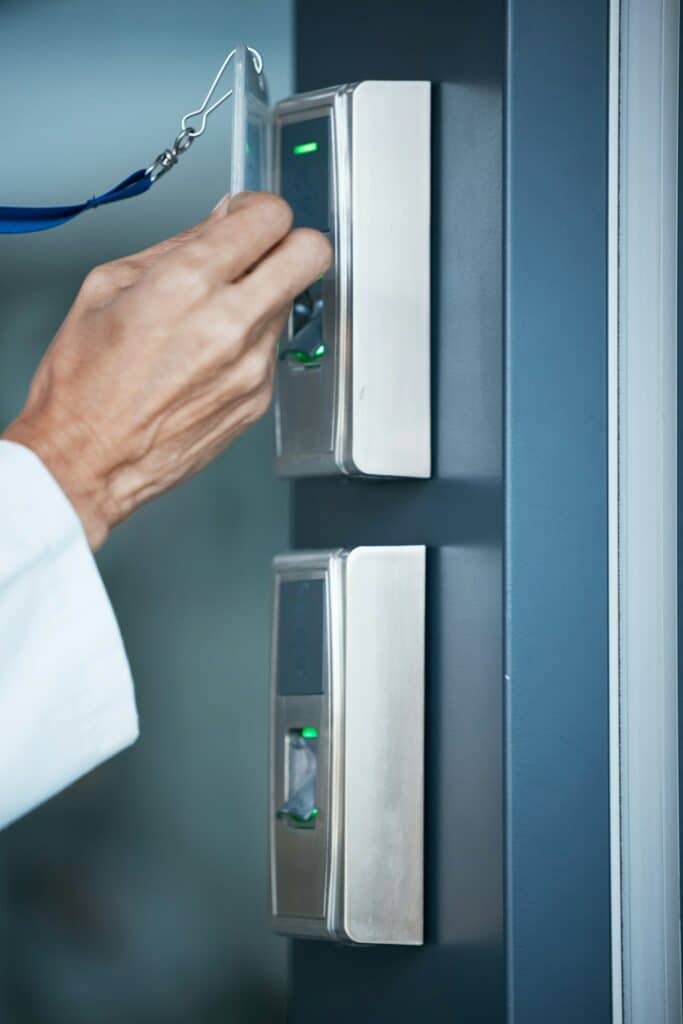 Hand, key card and scan on security door for entrance, access control and safety in business, prope